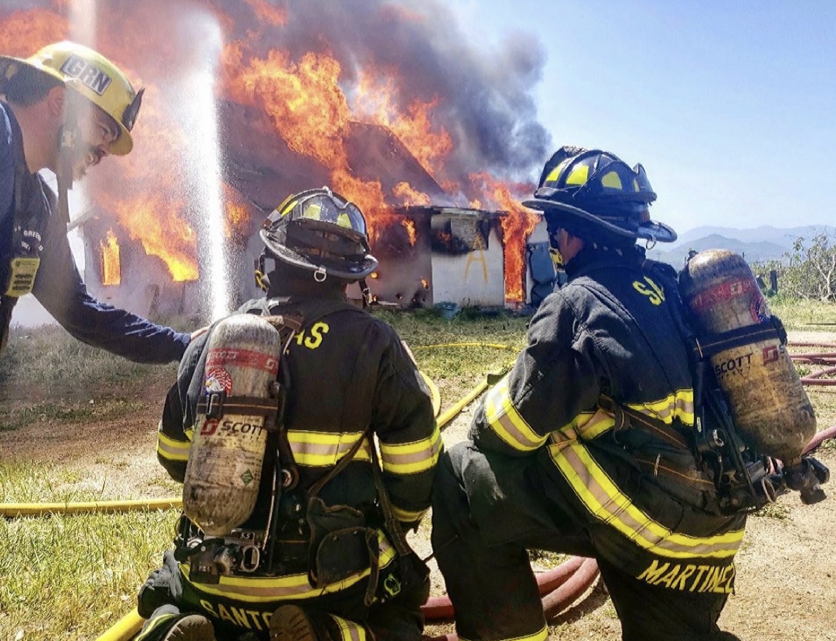 Fire guys in front of fire